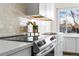 Modern kitchen with sleek countertops and stainless steel appliances at 3088 S Grape Way, Denver, CO 80222