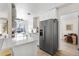 Modern kitchen with stainless steel appliances and white cabinetry at 3088 S Grape Way, Denver, CO 80222