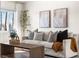 Cozy living room with light walls, neutral decor, and a comfy sofa at 3088 S Grape Way, Denver, CO 80222