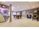 Finished basement featuring a jukebox, pool table, neon signs, a Simpsons pinball machine, and carpeted floors at 2522 W Dry Creek Ct, Littleton, CO 80120