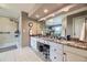 Bright bathroom with double sinks, granite countertops, white cabinets, large mirrors, and glass shower at 2522 W Dry Creek Ct, Littleton, CO 80120
