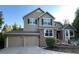 Beautiful two-story home with a three-car garage and brick accents in a well-manicured neighborhood at 2522 W Dry Creek Ct, Littleton, CO 80120