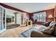 Inviting living room with hardwood floors, and office space with natural light from a large window at 2522 W Dry Creek Ct, Littleton, CO 80120