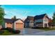 Exterior angle view of a home with a three-car garage and a covered porch for enjoying outdoor living at 2315 Illinois St, Golden, CO 80401