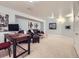 Basement living area featuring a comfortable seating area and a workspace with a computer at 13385 Jasmine St, Thornton, CO 80602