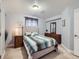 Comfortable bedroom features a queen bed, dresser, and calm decor at 13385 Jasmine St, Thornton, CO 80602