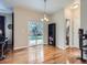 Open dining area with hardwood floors, sliding glass door to patio and modern lighting fixture at 13385 Jasmine St, Thornton, CO 80602