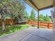 Covered patio with a well-maintained lawn and privacy fence at 13385 Jasmine St, Thornton, CO 80602