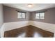 This bedroom features beautiful hardwood floors, and two large windows at 5063 W 61St Ave, Arvada, CO 80003