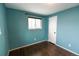 Bright bedroom with a large window, a closet, and stylish flooring at 5063 W 61St Ave, Arvada, CO 80003