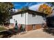 Charming home with vinyl siding, brick foundation and a spacious front yard at 5063 W 61St Ave, Arvada, CO 80003