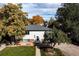 Charming home with well-maintained lawn, mature trees, and inviting front entrance at 5063 W 61St Ave, Arvada, CO 80003