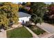 Beautiful two-story home with a well-maintained lawn, mature trees, and a welcoming front entrance at 5063 W 61St Ave, Arvada, CO 80003