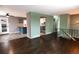 Open-concept kitchen featuring stainless steel appliances and an eat-in breakfast bar at 5063 W 61St Ave, Arvada, CO 80003