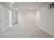 Spacious basement features a carpeted floor, white walls and trim and natural light at 652 N Gilpin St, Denver, CO 80218