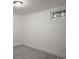 Finished basement has carpet flooring, small window and white painted walls at 652 N Gilpin St, Denver, CO 80218