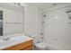 Clean and bright bathroom features tiled shower, tub combo, and classic vanity at 652 N Gilpin St, Denver, CO 80218