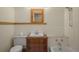 Traditional bathroom with white tiled walls and a vintage wood cabinet sink at 652 N Gilpin St, Denver, CO 80218
