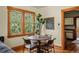 Bright dining area with a round table, wood floors, and lots of natural light at 652 N Gilpin St, Denver, CO 80218
