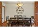 Formal dining room featuring hardwood floors, a large table, and decorative lighting at 652 N Gilpin St, Denver, CO 80218