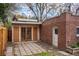 View of the detached garage, featuring three wooden doors at 652 N Gilpin St, Denver, CO 80218