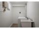Functional laundry room featuring a washer, dryer, and utility sink at 652 N Gilpin St, Denver, CO 80218