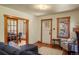 Bright living room with hardwood floors, wood trim, and view into the dining room at 652 N Gilpin St, Denver, CO 80218
