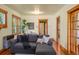Cozy living area with a comfortable sectional sofa, hardwood floors, and natural light at 652 N Gilpin St, Denver, CO 80218