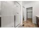 Bright bathroom featuring a glass shower and closet at 3401 N Denali St, Aurora, CO 80019