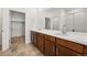 Bathroom features a double sink vanity and large mirror at 3401 N Denali St, Aurora, CO 80019