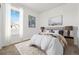 Bright bedroom with a large window, neutral tones, and stylish decor creating a relaxing space at 3401 N Denali St, Aurora, CO 80019