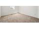 A bright bedroom features neutral carpet and one window at 3401 N Denali St, Aurora, CO 80019