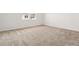 A bright bedroom features neutral carpet and large windows at 3401 N Denali St, Aurora, CO 80019