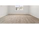 This carpeted bedroom features two bright windows at 3401 N Denali St, Aurora, CO 80019