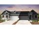 Modern duplex boasts symmetrical design, neutral colors, and convenient two-car garages at 3401 N Denali St, Aurora, CO 80019