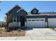 Charming one-story home with grey siding, white trim, a two-car garage, and beautifully landscaped front yard at 3401 N Denali St, Aurora, CO 80019