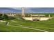 Green space featuring beautiful landscaping, walking path, and stone architectural elements at 3401 N Denali St, Aurora, CO 80019