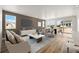 Cozy living area features large windows, plush seating, and open layout at 3401 N Denali St, Aurora, CO 80019