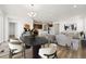 Open concept living and dining area with wood floors and modern decor at 3401 N Denali St, Aurora, CO 80019
