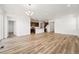 Bright, open living space showcasing modern finishes, wood floors, and ample room for comfortable living and entertaining at 3401 N Denali St, Aurora, CO 80019