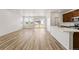 Bright living and kitchen area with modern floors, neutral walls, and sliding glass doors for natural light at 3401 N Denali St, Aurora, CO 80019