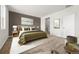 Serene main bedroom featuring soft carpet, modern decor, and ensuite bathroom at 3401 N Denali St, Aurora, CO 80019