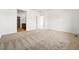 A carpeted main bedroom leads to a bathroom and closet at 3401 N Denali St, Aurora, CO 80019