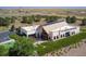 Exterior of an office building featuring modern architecture, landscaping, and ample parking at 3401 N Denali St, Aurora, CO 80019