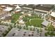 Aerial view of town center with retail and recreational buildings, parking, and green space at 3401 N Denali St, Aurora, CO 80019