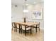 Dining room featuring hardwood floors and a wooden dining table with seating for six at 3221 Perry St, Denver, CO 80212