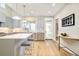 Contemporary kitchen with stainless steel appliances, sleek countertops, and an island with seating at 3221 Perry St, Denver, CO 80212