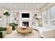 Bright living room with custom shelving, fireplace, and stylish furniture and decor at 3221 Perry St, Denver, CO 80212