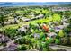 Aerial view of the neighborhood and home with an arrow marking its location near a golf course at 14118 Whitney Cir, Broomfield, CO 80023