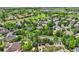 Wide aerial view of a residential area with well-maintained homes and green spaces, including a golf course at 14118 Whitney Cir, Broomfield, CO 80023